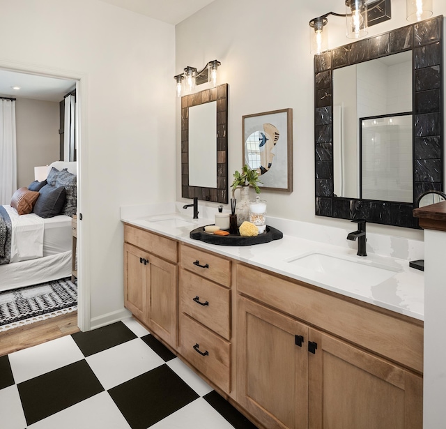 bathroom with ensuite bath, tile patterned floors, tiled shower, and double vanity