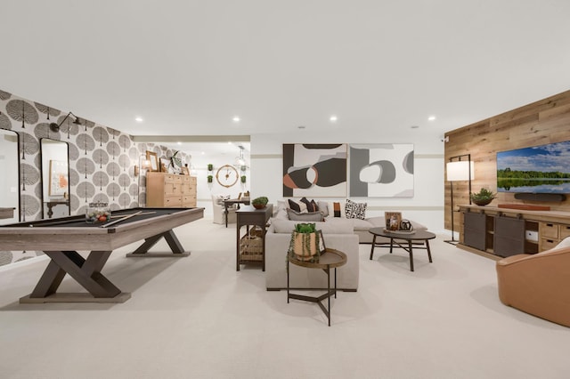 rec room featuring an accent wall, wooden walls, recessed lighting, wallpapered walls, and carpet