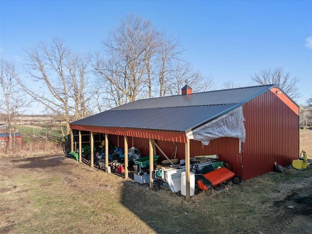 view of parking featuring an outbuilding