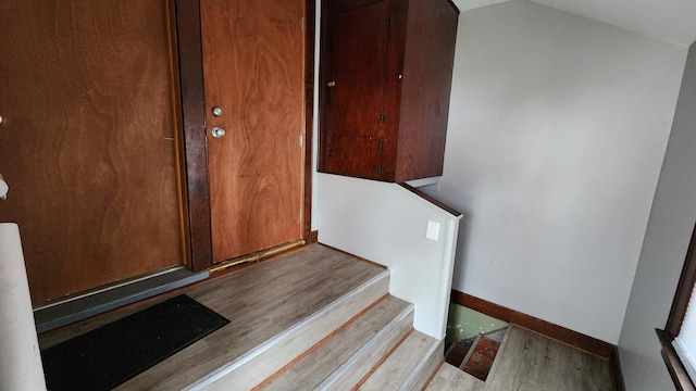 1110 Oakland Ave, Austin, MN 55912 - staircase featuring wood finished floors and baseboards
