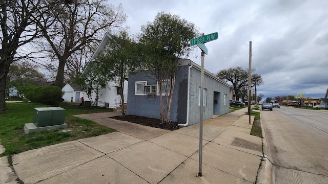 1110 Oakland Ave, Austin, MN 55912 - view of property exterior with concrete block siding and entry steps