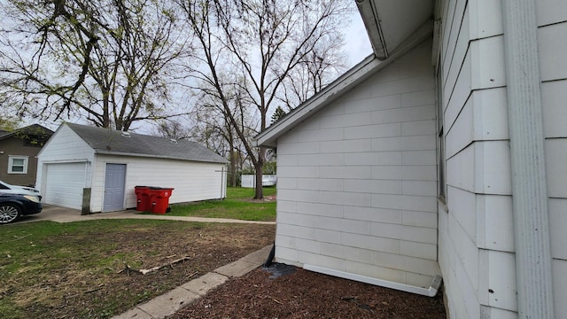 1110 Oakland Ave, Austin, MN 55912 - view of side of property with a detached garage and an outbuilding