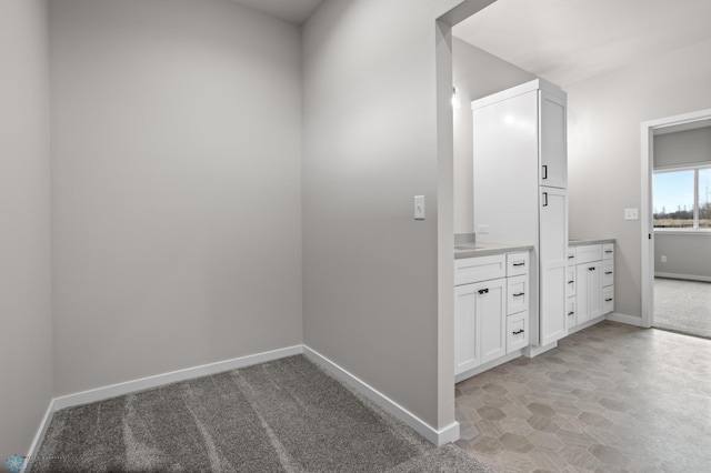 bathroom featuring vanity and baseboards