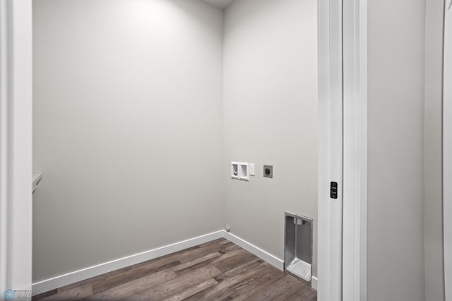 laundry area with laundry area, dark wood-style flooring, baseboards, hookup for a washing machine, and electric dryer hookup