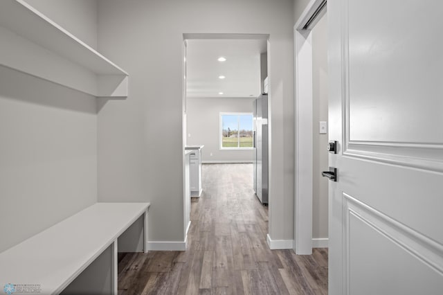 mudroom with baseboards, recessed lighting, and wood finished floors
