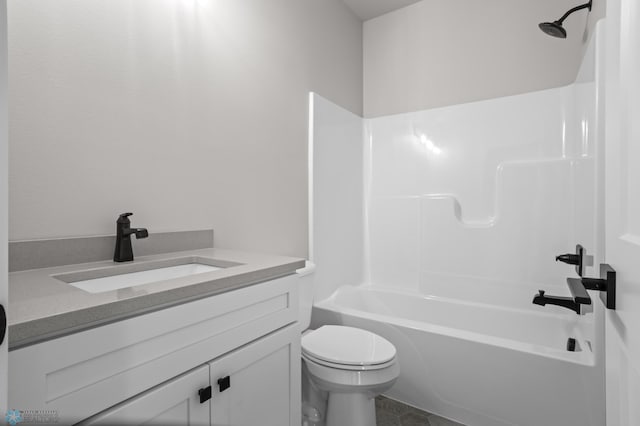 bathroom featuring shower / bath combination, vanity, and toilet