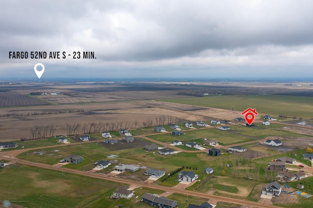 drone / aerial view featuring a residential view and a rural view