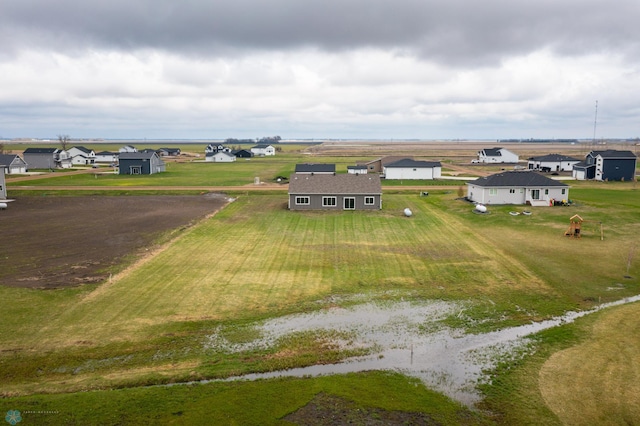 birds eye view of property with a rural view