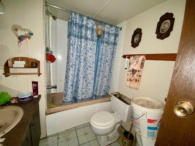 bathroom with vanity, tile patterned flooring, shower / bath combo, and toilet