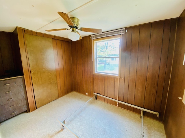 9199 County Road Y, Wascott, WI 54838 - carpeted empty room featuring wood walls and ceiling fan