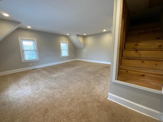 bonus room featuring recessed lighting, stairs, carpet, and baseboards