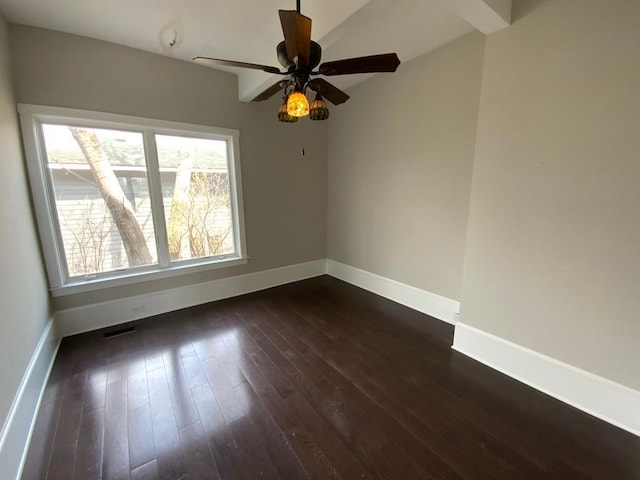 unfurnished room with baseboards, dark wood-style flooring, ceiling fan, and visible vents