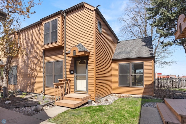 view of front of home featuring roof with shingles