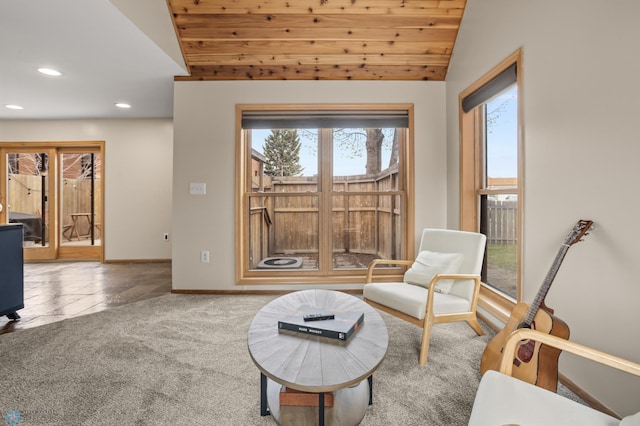 sitting room with vaulted ceiling, carpet flooring, recessed lighting, baseboards, and wood ceiling