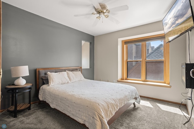 carpeted bedroom featuring baseboards and ceiling fan