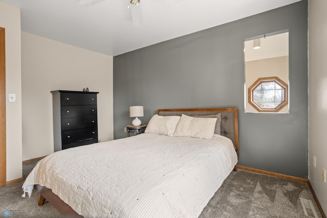 bedroom featuring carpet, baseboards, and a ceiling fan