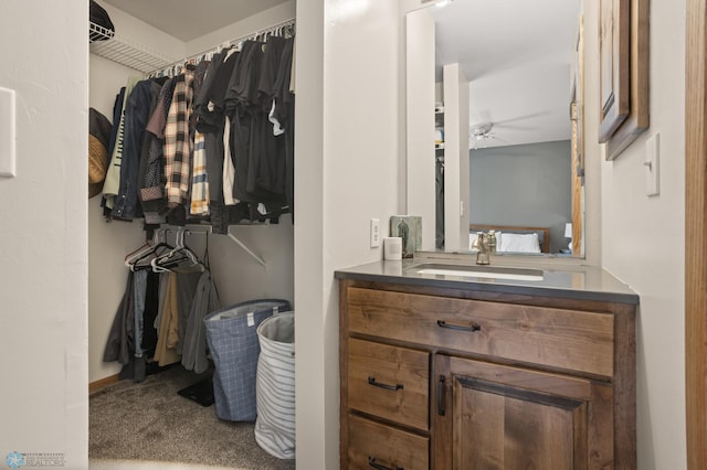 bathroom featuring vanity and ceiling fan
