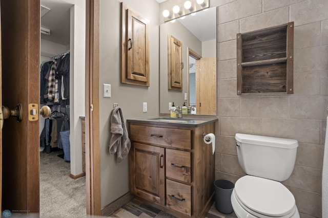 bathroom with toilet and vanity