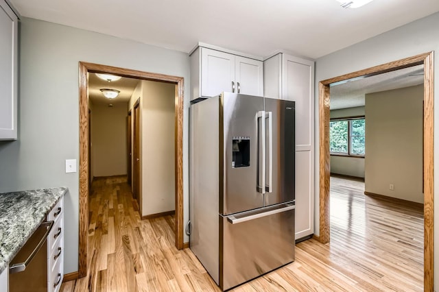 1877 Quasar Ave S, Lake Saint Croix Beach, MN 55043 - kitchen featuring stainless steel fridge with ice dispenser, light wood-type flooring, white cabinets, and light stone counters