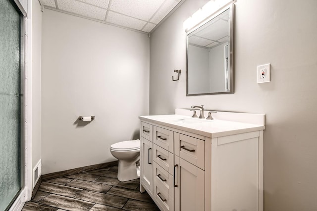 1877 Quasar Ave S, Lake Saint Croix Beach, MN 55043 - bathroom with vanity, a drop ceiling, and wood finish floors