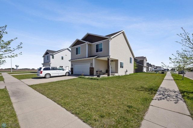 view of side of home featuring driveway, a garage, a yard, and a residential view