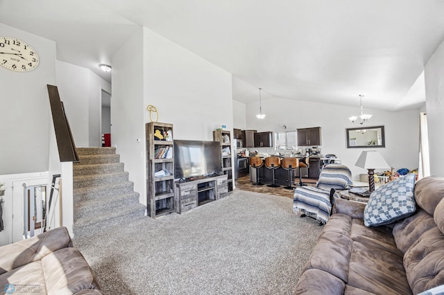 living area featuring a chandelier, carpet flooring, stairs, and high vaulted ceiling