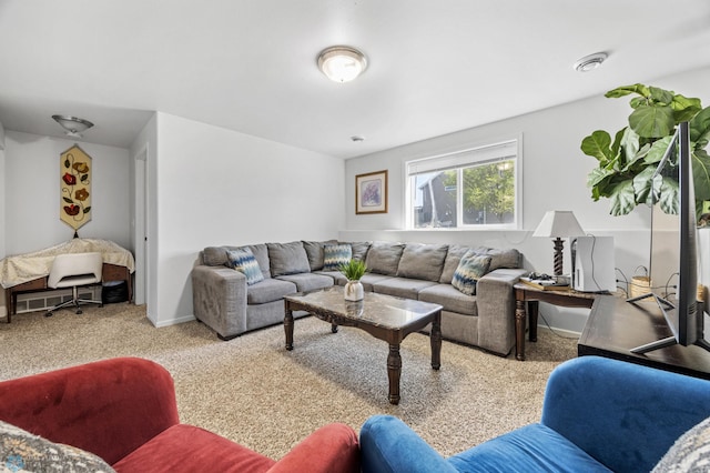 living room featuring carpet floors and baseboards