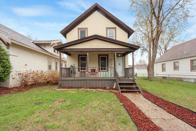 view of front of property featuring fence, stucco siding, a porch, and a front lawn