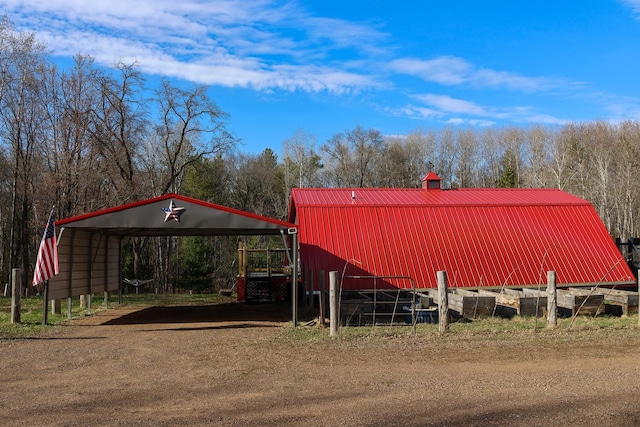 N8690 Island Lake Rd, Casey, WI 54801 - exterior space with a detached carport