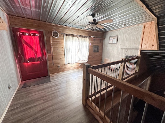 N8690 Island Lake Rd, Casey, WI 54801 - hallway with wood walls, wooden ceiling, wood finished floors, and an upstairs landing