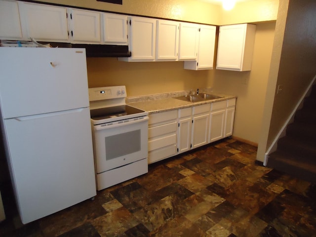 kitchen with a sink, white cabinets, and white appliances