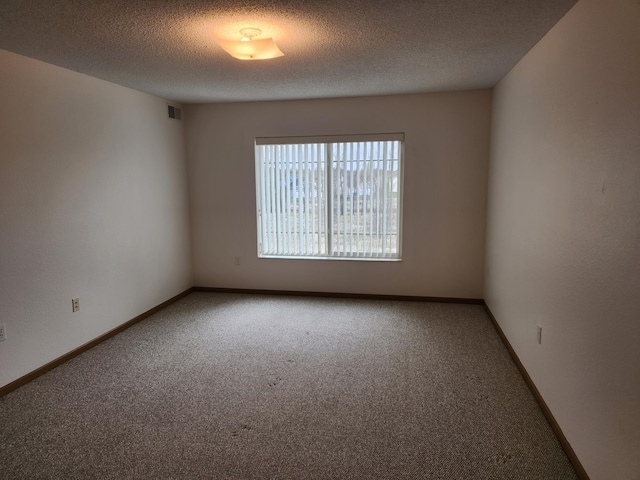 2155 6th Ln SE Unit 212, Cambridge, MN 55008 - carpeted empty room with a textured ceiling and baseboards