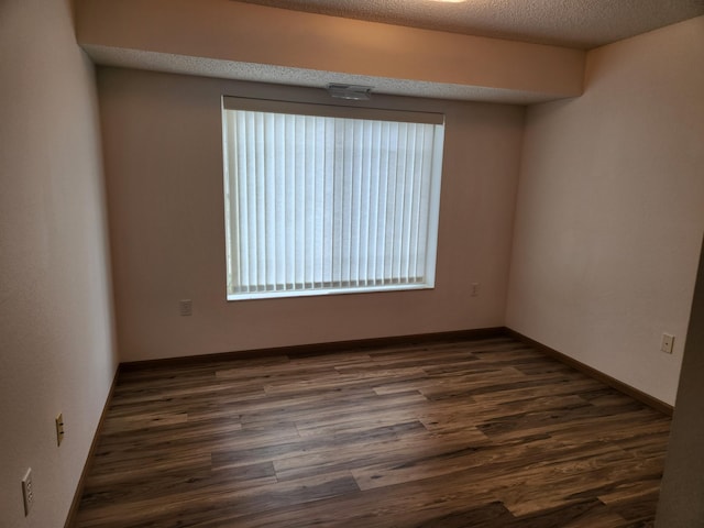 2155 6th Ln SE Unit 212, Cambridge, MN 55008 - unfurnished room with dark wood-style flooring