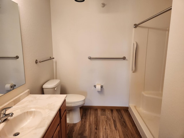 2155 6th Ln SE Unit 212, Cambridge, MN 55008 - bathroom featuring wood finished floors, a shower, and vanity