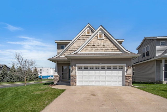1501 Praha St SE, New Prague, MN 56071 - craftsman-style home featuring concrete driveway, a garage, stone siding, and a front yard
