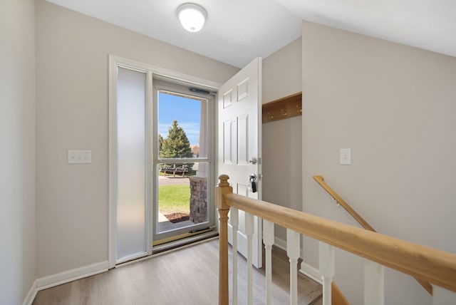 1501 Praha St SE, New Prague, MN 56071 - doorway to outside featuring baseboards, lofted ceiling, and light wood-style flooring