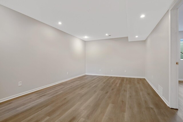 1501 Praha St SE, New Prague, MN 56071 - spare room with visible vents, light wood-style flooring, baseboards, and recessed lighting