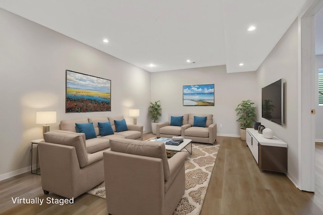 1501 Praha St SE, New Prague, MN 56071 - living room featuring baseboards, light wood-type flooring, and recessed lighting