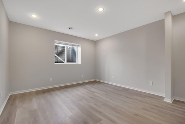1501 Praha St SE, New Prague, MN 56071 - spare room featuring light wood finished floors, baseboards, and recessed lighting