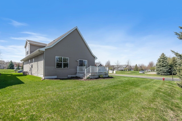 1501 Praha St SE, New Prague, MN 56071 - view of property exterior featuring a yard and a deck