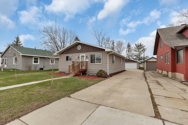 view of front facade with a garage, an outdoor structure, and a front yard