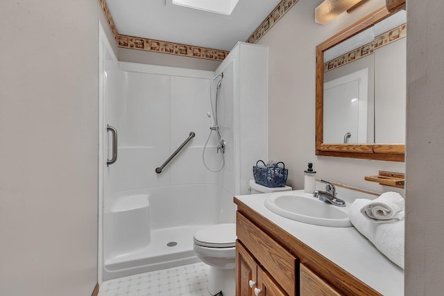full bath featuring vanity, tile patterned floors, walk in shower, and toilet