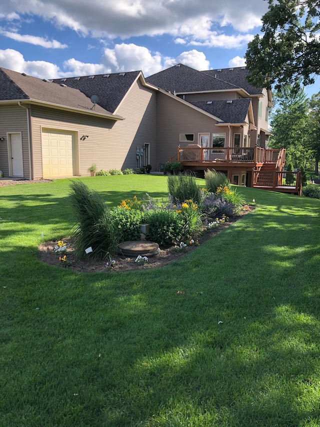 25124 Firefly Ave, Wyoming, MN 55092 - rear view of house with a wooden deck, a lawn, a garage, and a shingled roof