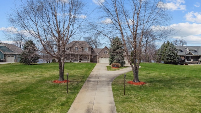25124 Firefly Ave, Wyoming, MN 55092 - view of front of property featuring a front yard, a garage, driveway, and a residential view