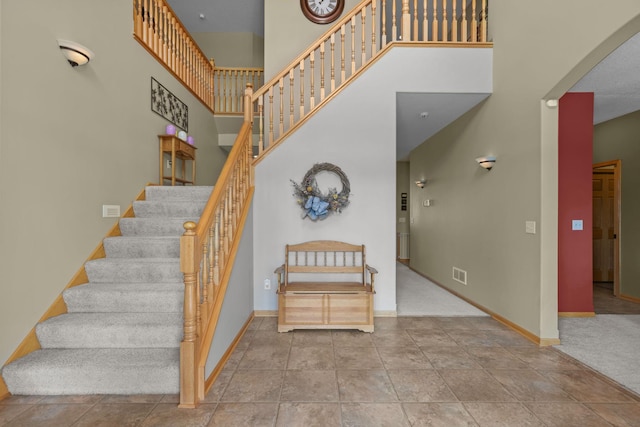 25124 Firefly Ave, Wyoming, MN 55092 - stairs featuring arched walkways, baseboards, and a high ceiling