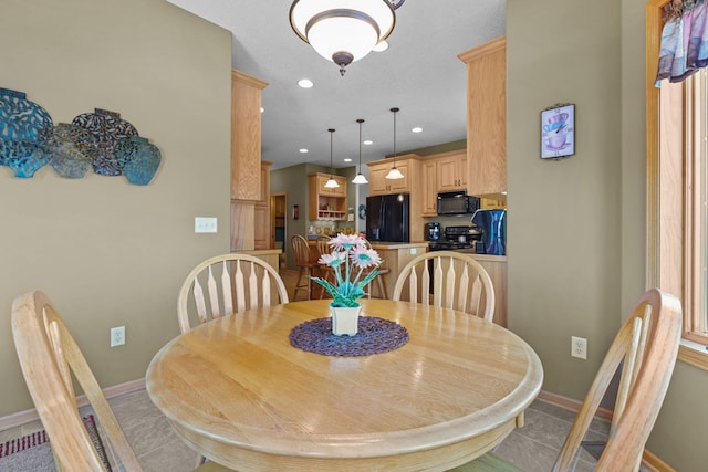 25124 Firefly Ave, Wyoming, MN 55092 - dining space featuring baseboards, light tile patterned floors, and recessed lighting