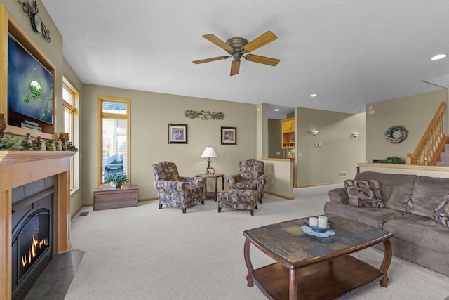 25124 Firefly Ave, Wyoming, MN 55092 - carpeted living area with a fireplace, a ceiling fan, and recessed lighting