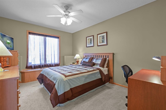 25124 Firefly Ave, Wyoming, MN 55092 - bedroom featuring light carpet, a desk, a ceiling fan, and baseboards