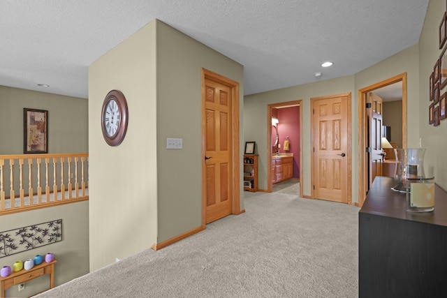 25124 Firefly Ave, Wyoming, MN 55092 - corridor with carpet floors, a textured ceiling, recessed lighting, and baseboards