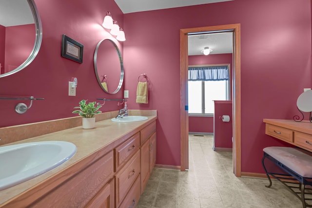 25124 Firefly Ave, Wyoming, MN 55092 - bathroom featuring baseboards, double vanity, and tile patterned flooring